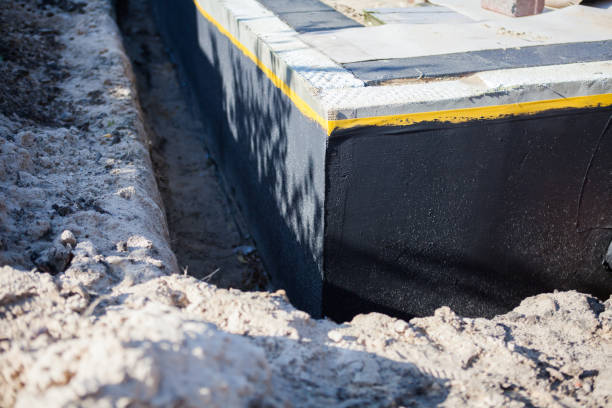 Professional Basement Waterproofing technician working in Clay Center, KS